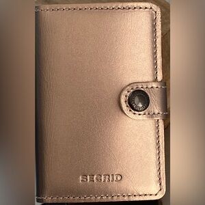 NEW-SECRID METALLIC ROSE GOLD CARDHOLDER WALLET WITH ECCO LOGO